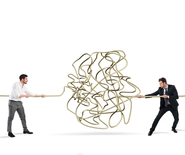 Businessmen try to solve a tangled rope. Concept of partnership and cooperation