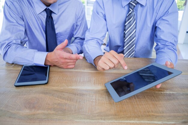 Businessmen using tablet