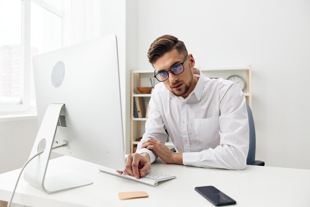 Businessmen wearing glasses sits at a desk office worked\
executive