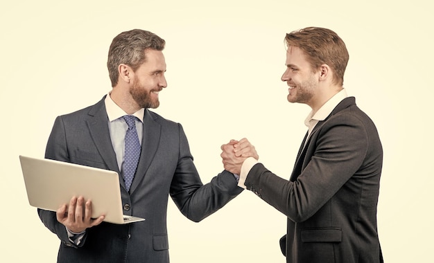 Businessmen with laptop on meeting boss and employee partners after business deal