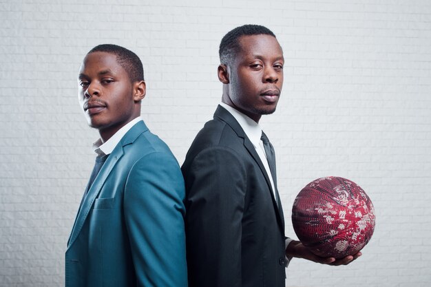 Businessmen with soccer ball