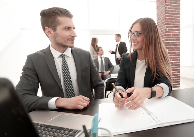 Businessmen working together with his colleague in office