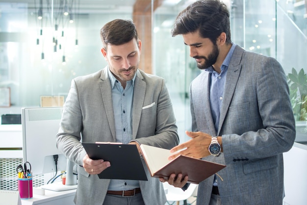 businessmen working with documents together in office