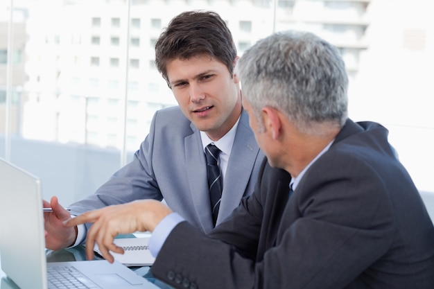 Businessmen working with a laptop