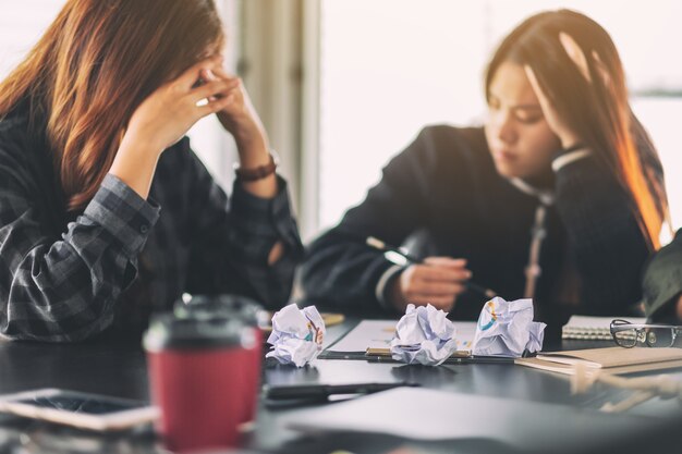 Businesspeople get stressed while having a problem in business meeting