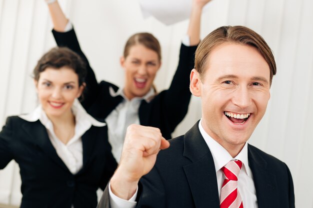 Businesspeople in office having great success