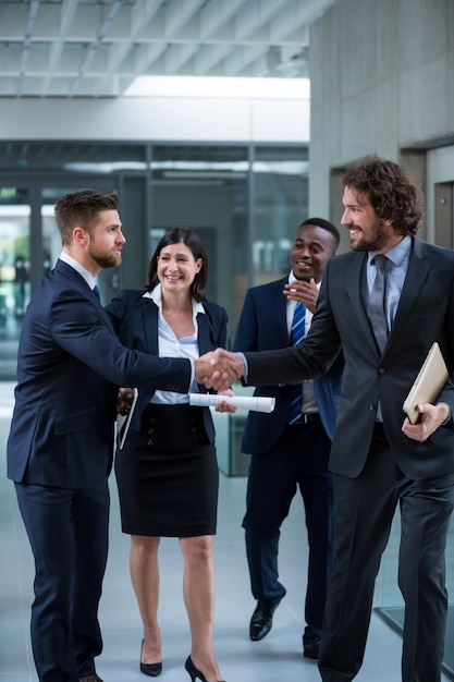 Businesspeople shaking hands with each other