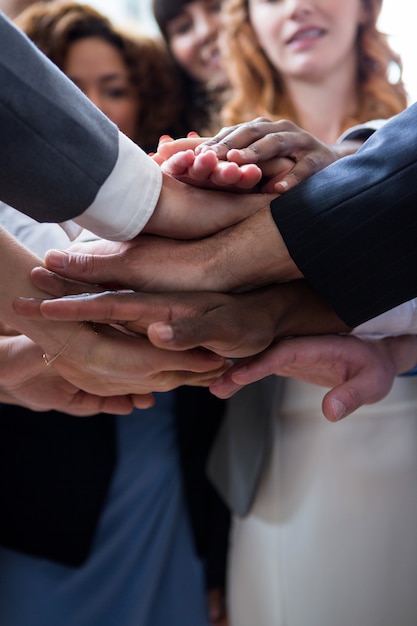 Businesspeople with hand stacked