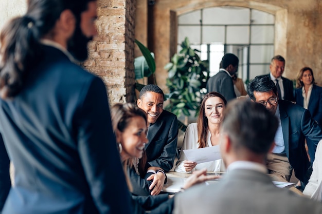 Businesspeople working in office lawyers brainstorming in law firm manager staff meeting