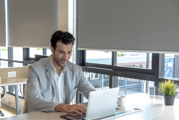 Businesss man use laptop computer in workplace