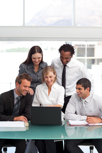 Businessteam working together with a laptop