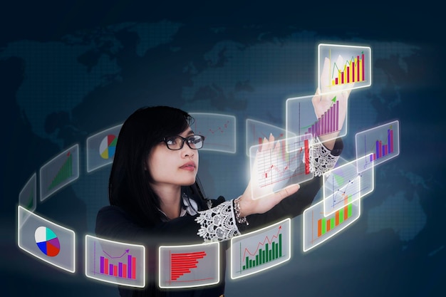 a businesswoman analyzes business chart