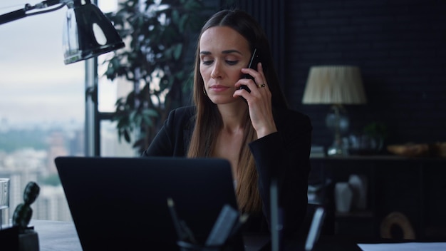 Businesswoman answering on phone call at office Lady talking on smartphone