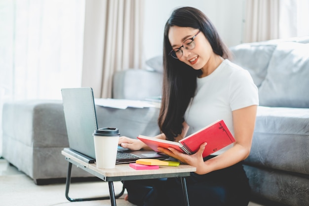 Businesswoman are work with laptop computer from home, woman person working with online communication business and technology, workplace desk with notebook indoor isolated in a house