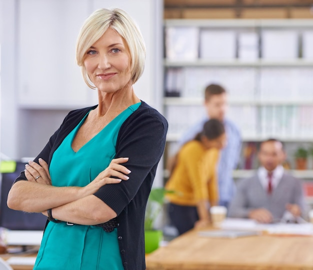 Businesswoman arms crossed and portrait in office or workplace for presentation or meeting with confidence mature person entrepreneur and corporate at work professional or formal in boardroom