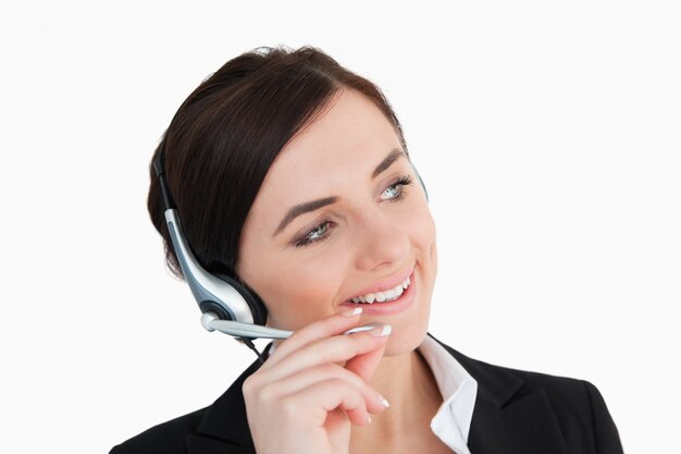 Photo businesswoman in black suit using a headset