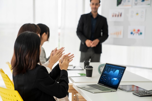 Businesswoman in business meeting using laptop computer proficiently at office