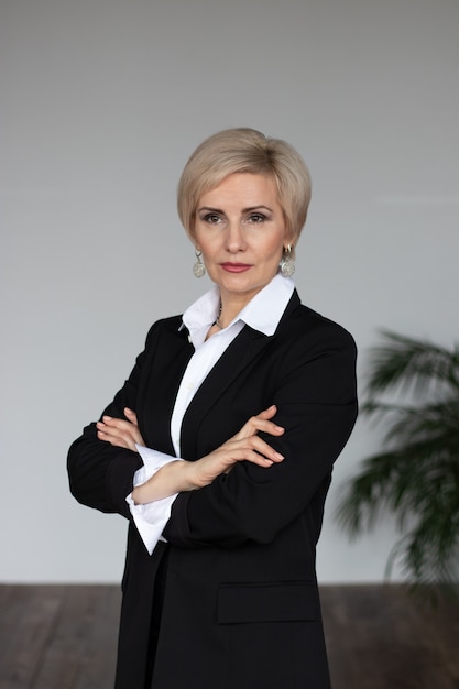 businesswoman in a business suit stands portrait