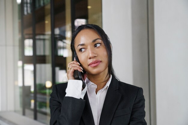 Businesswoman calling with her smartphone