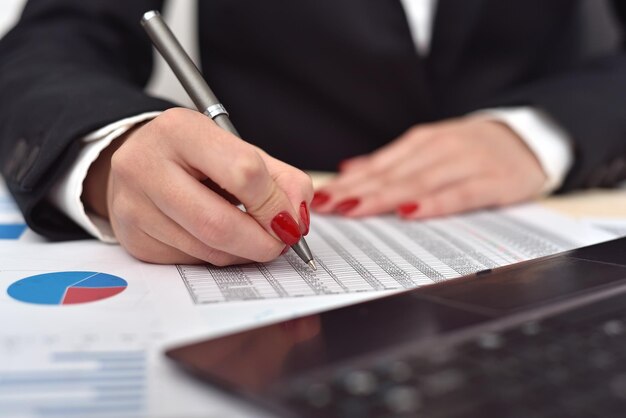 Businesswoman checks the start up report