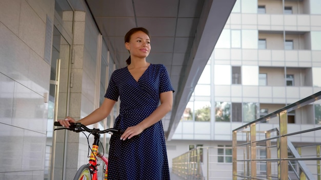 Businesswoman commute to work on bicycle in summer