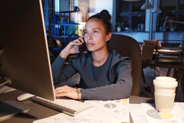 Businesswoman discussing charts on computer