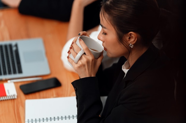 Businesswoman discussing strategy for concept of harmony in office with coffee