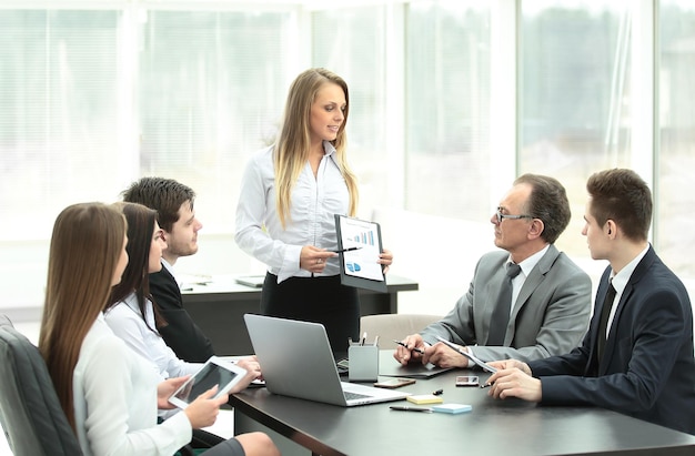 Businesswoman explaining business plan to her colleagues