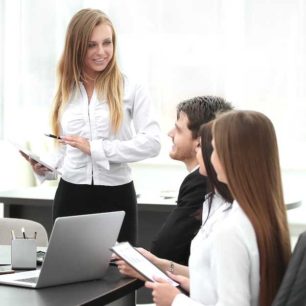 Businesswoman explaining business plan to her colleagues