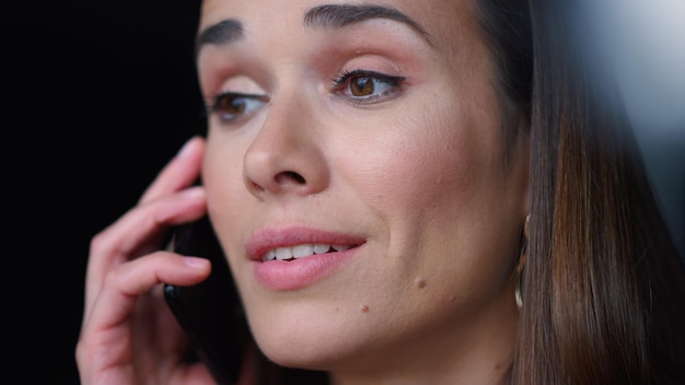 Businesswoman face talking on smartphone Excited employee calling on cellphone