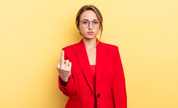 Businesswoman feeling angry, annoyed, rebellious and aggressive