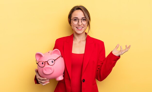 Businesswoman feeling happy surprised realizing a solution or idea piggy bank concept