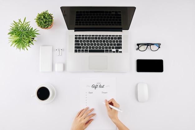 Businesswoman filling gift list