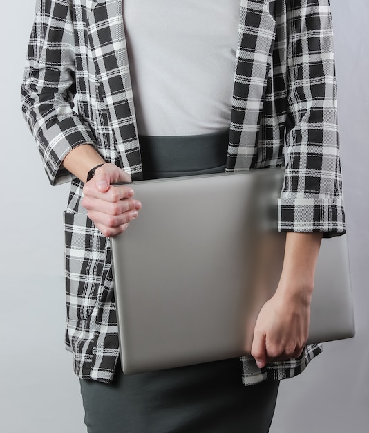 Businesswoman in formal clothes with laptop