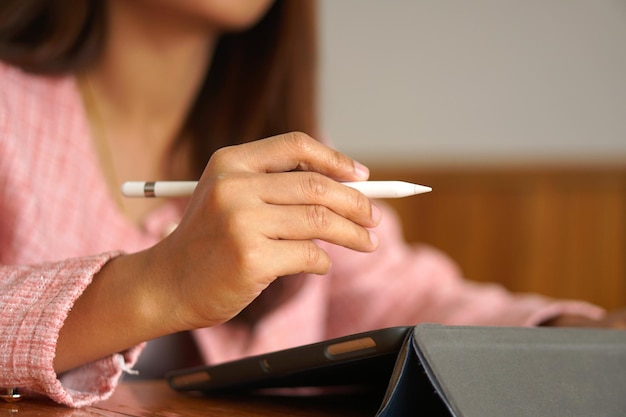 Businesswoman hand using computer to analyze sales in order to maximize profits