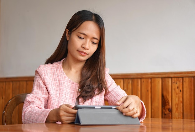 Businesswoman hand using computer to analyze sales in order to maximize profits