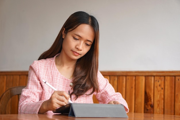 Businesswoman hand using computer to analyze sales in order to maximize profits