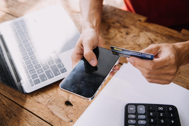 Businesswoman hands holding cradit card and using credit card online shopping Online shopping concept