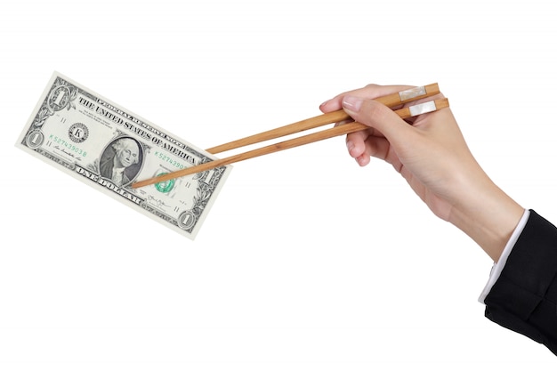 Businesswoman hands holding dollar money by chopsticks