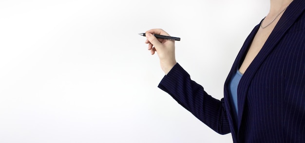 Businesswoman hold pen on virtual screen dark background\
closeup closeup of hand holding a black marker about to write\
something