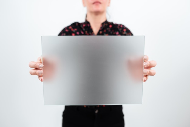 Businesswoman holding blank placard and making important announcement woman with rectangular