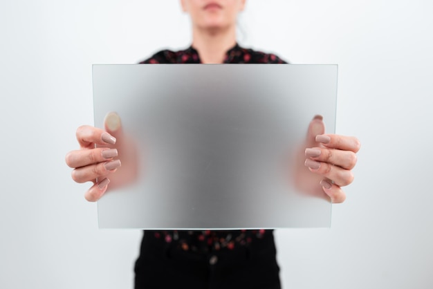 Businesswoman holding blank placard and making important announcement woman with rectangular