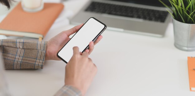 Businesswoman holding blank screen smartphone 