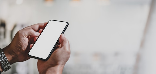 businesswoman holding blank screen smartphone