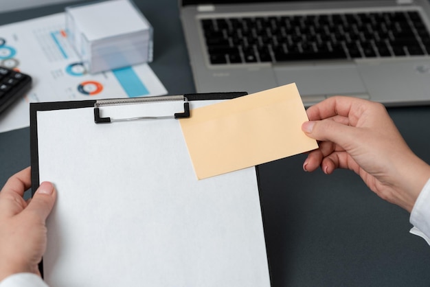 Businesswoman Holding Clipboard And Note On It With Important Messages Woman Having Memo With Crutial Information Executive Showing Critical Data On Paper