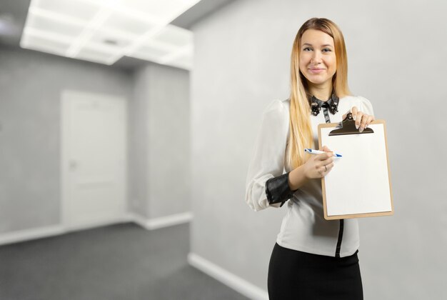 Businesswoman holding a clipboard