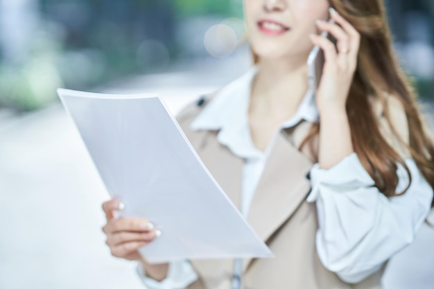 Businesswoman holding a file with documents