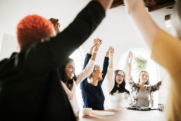 Businesswoman holding hands and raised