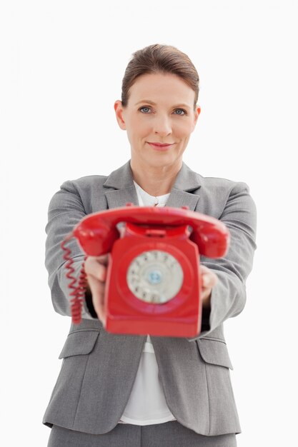 Businesswoman holding out the phone