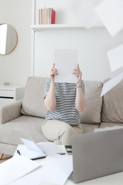 Businesswoman holding papers preparing report analyzing work results female executive doing paperwork at workplace copy space data analysis